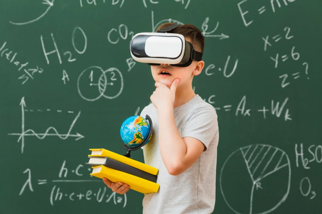 side-view-boy-wearing-virtual-reality-headset-holding-books